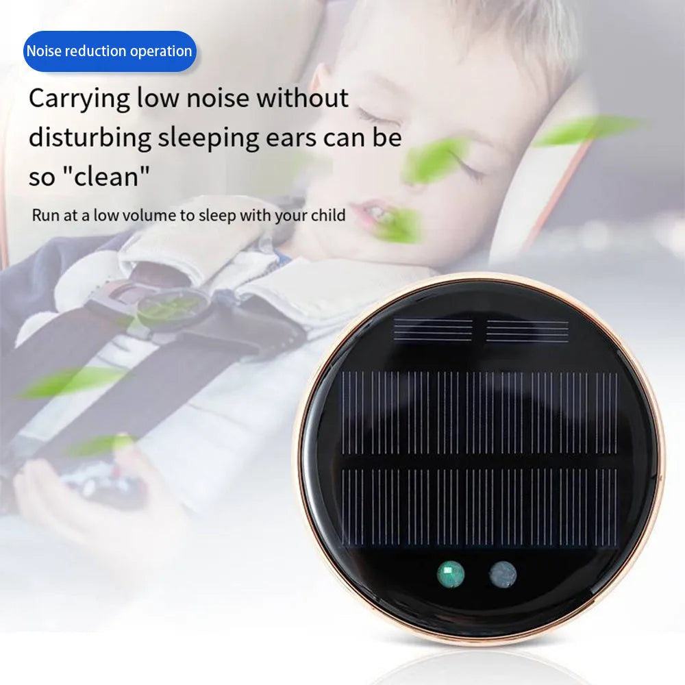 Compact black solar-powered car air humidifier installed in a vehicle air vent.