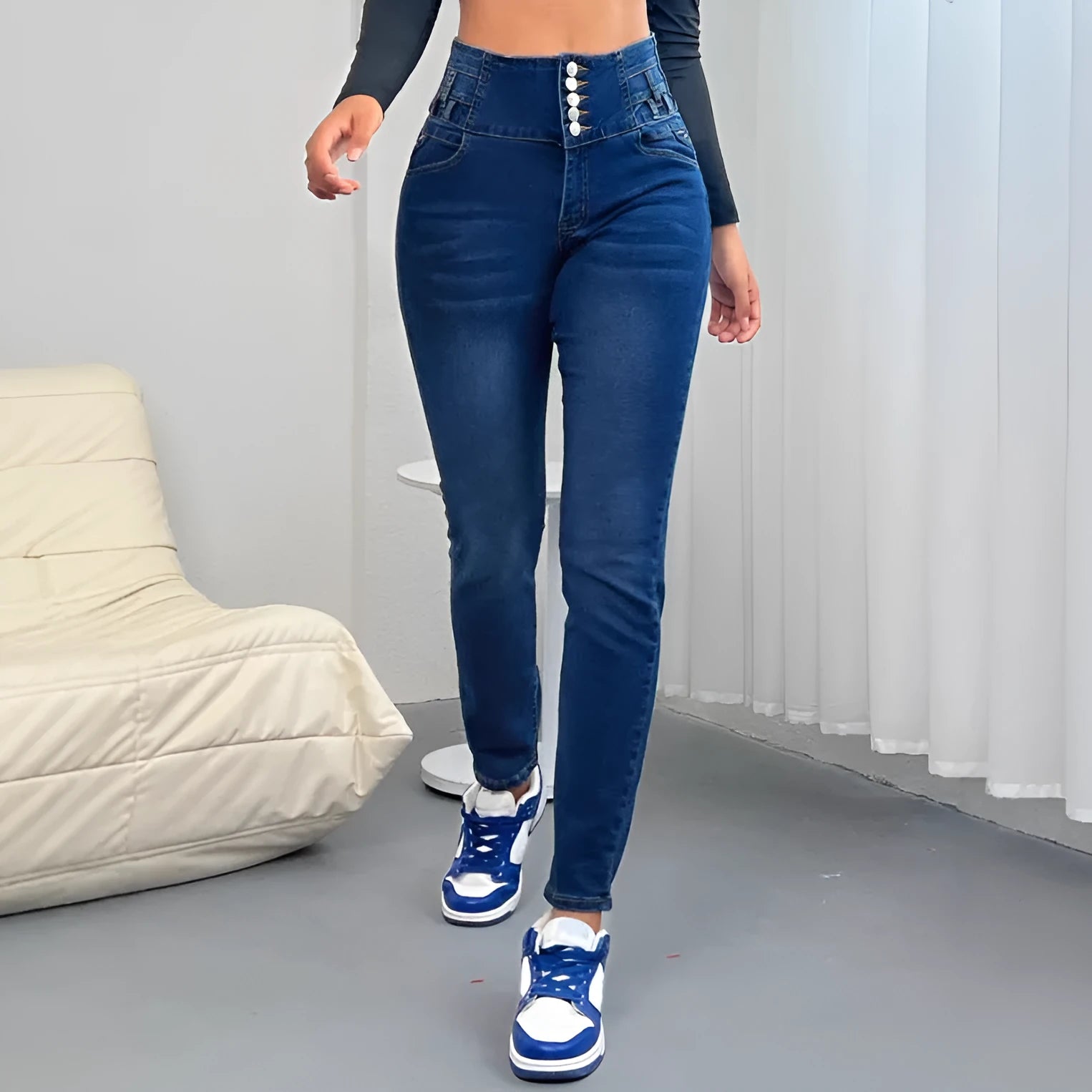 Women's dark blue straight-leg denim jeans with button detail and zipper closure