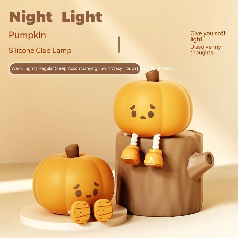 Soft silicone pumpkin night light with touch dimming controls and USB charging port