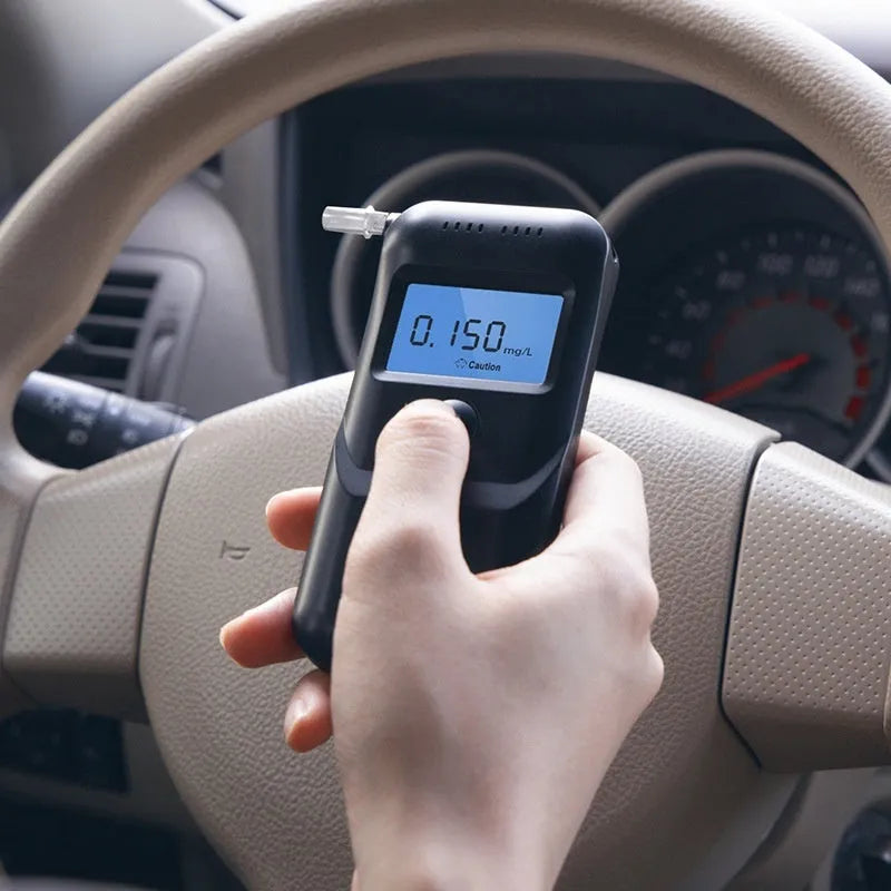 Black household alcohol tester with digital display for breath alcohol measurement and drunk driving checks