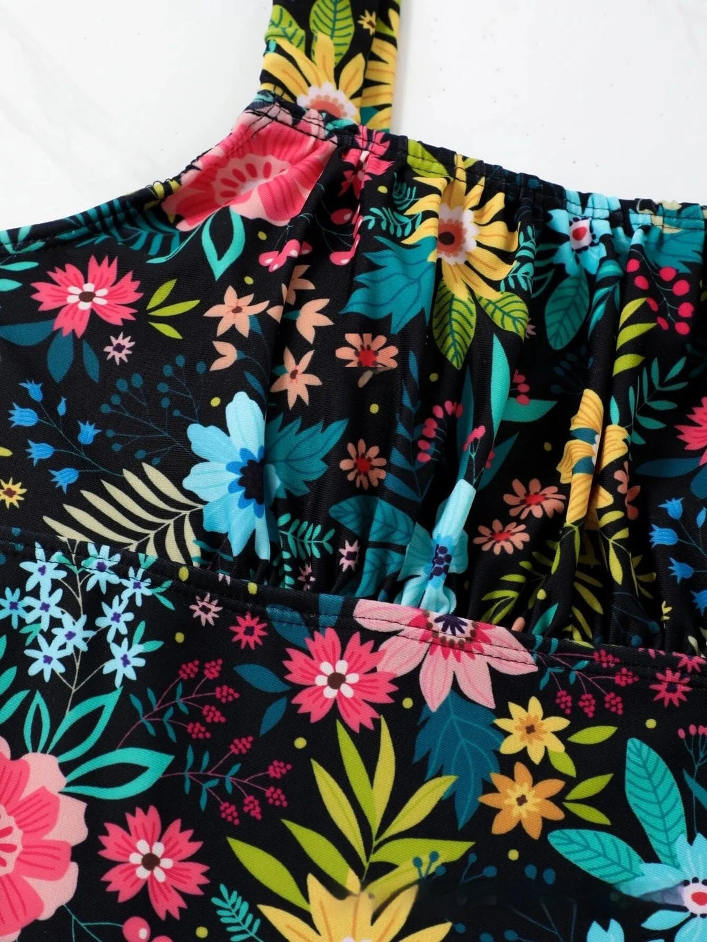 Women's pastoral floral print one-piece swimsuit shown in available colours with full-bed design