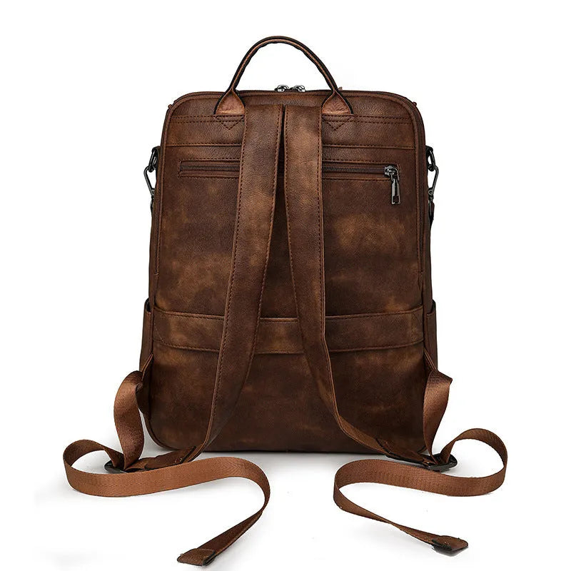 Retro college student backpack with curved shoulder straps in six colour options including black, blue and brown variations