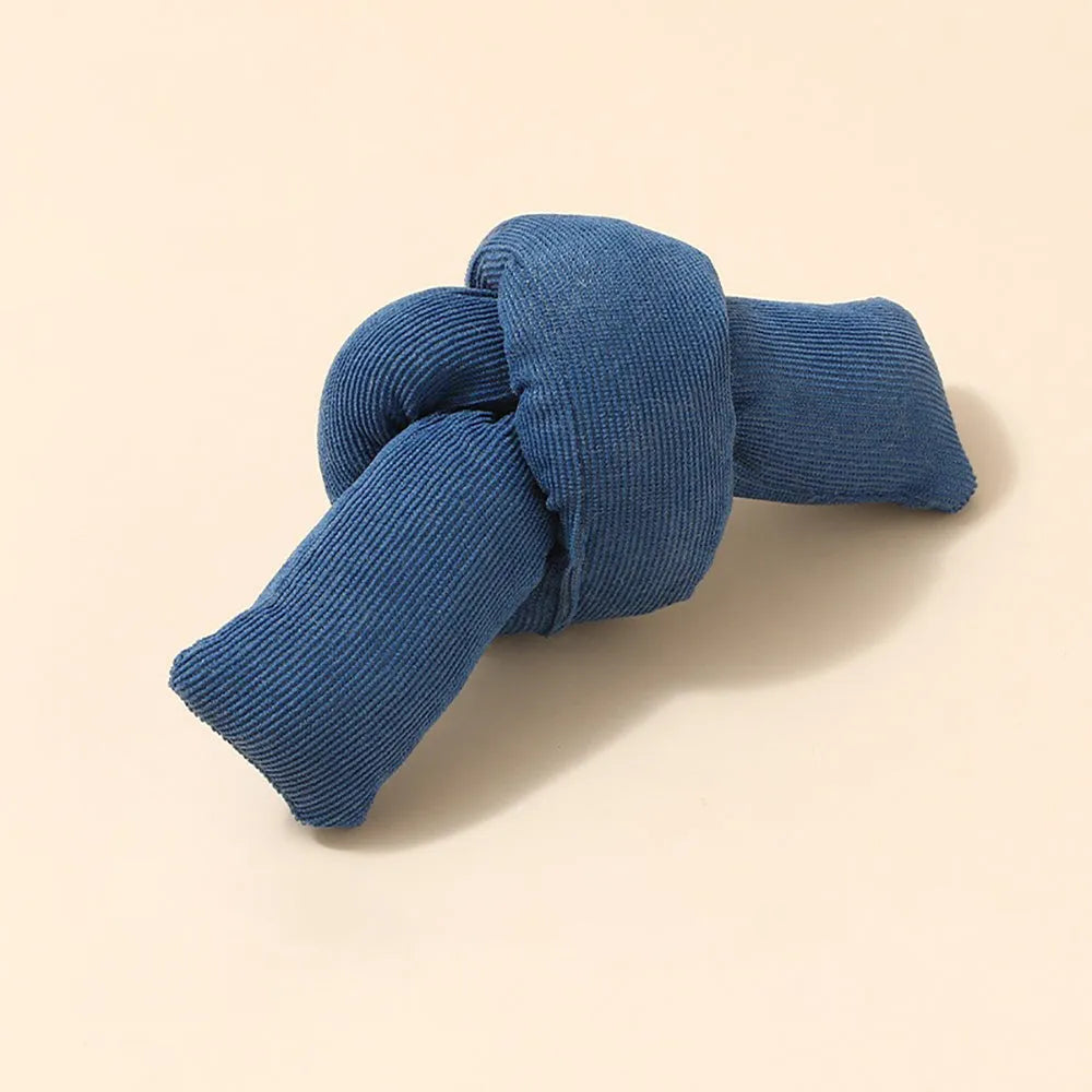 White knotted cotton rope dog toy for chewing and tug of war.
