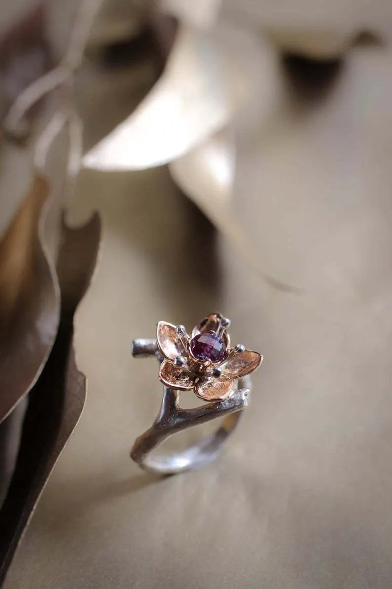 Silver two-tone women's ring with a geometric floral pattern on an alloy band.