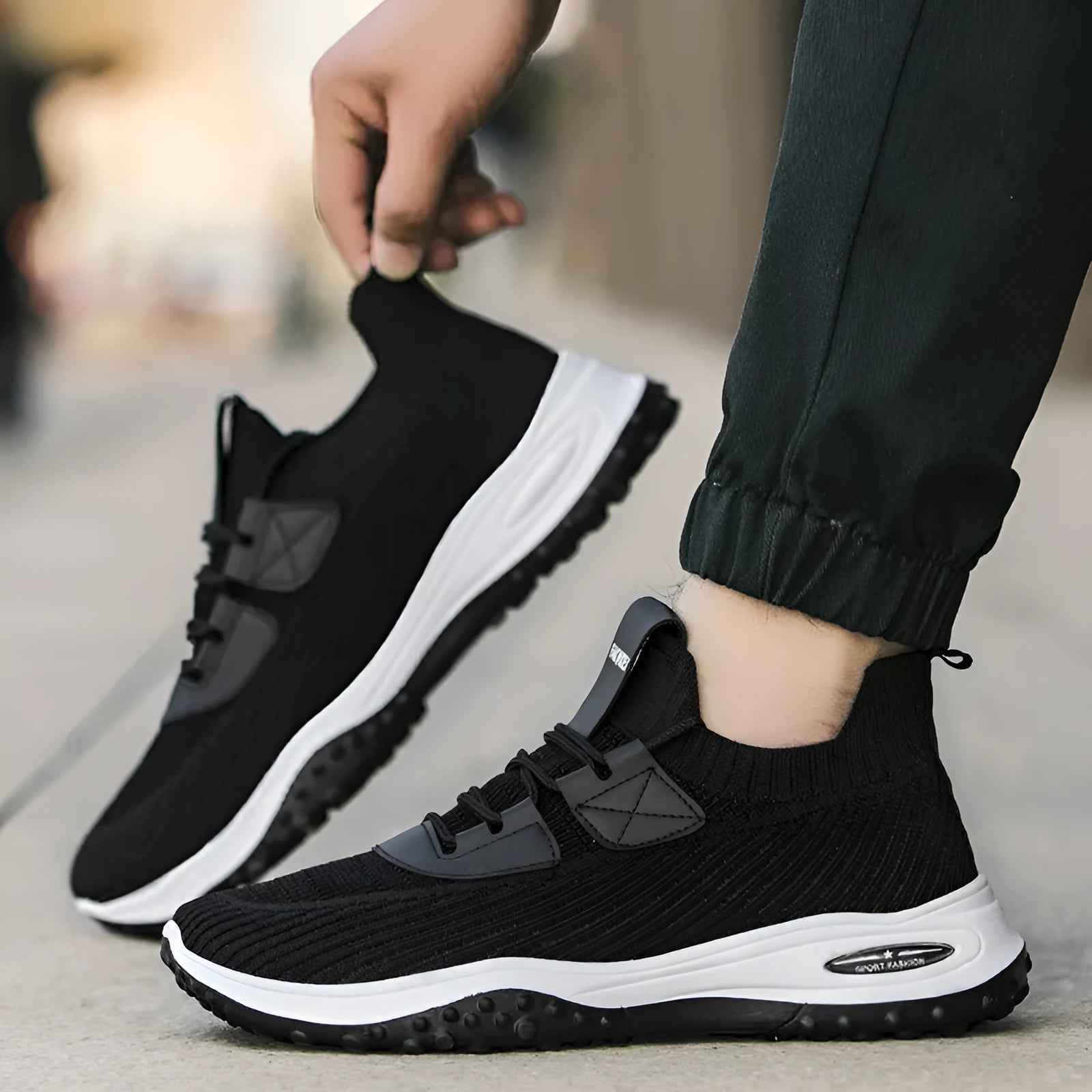 Black Flyknit low-top running shoes with mesh lining and a flat plastic sole.