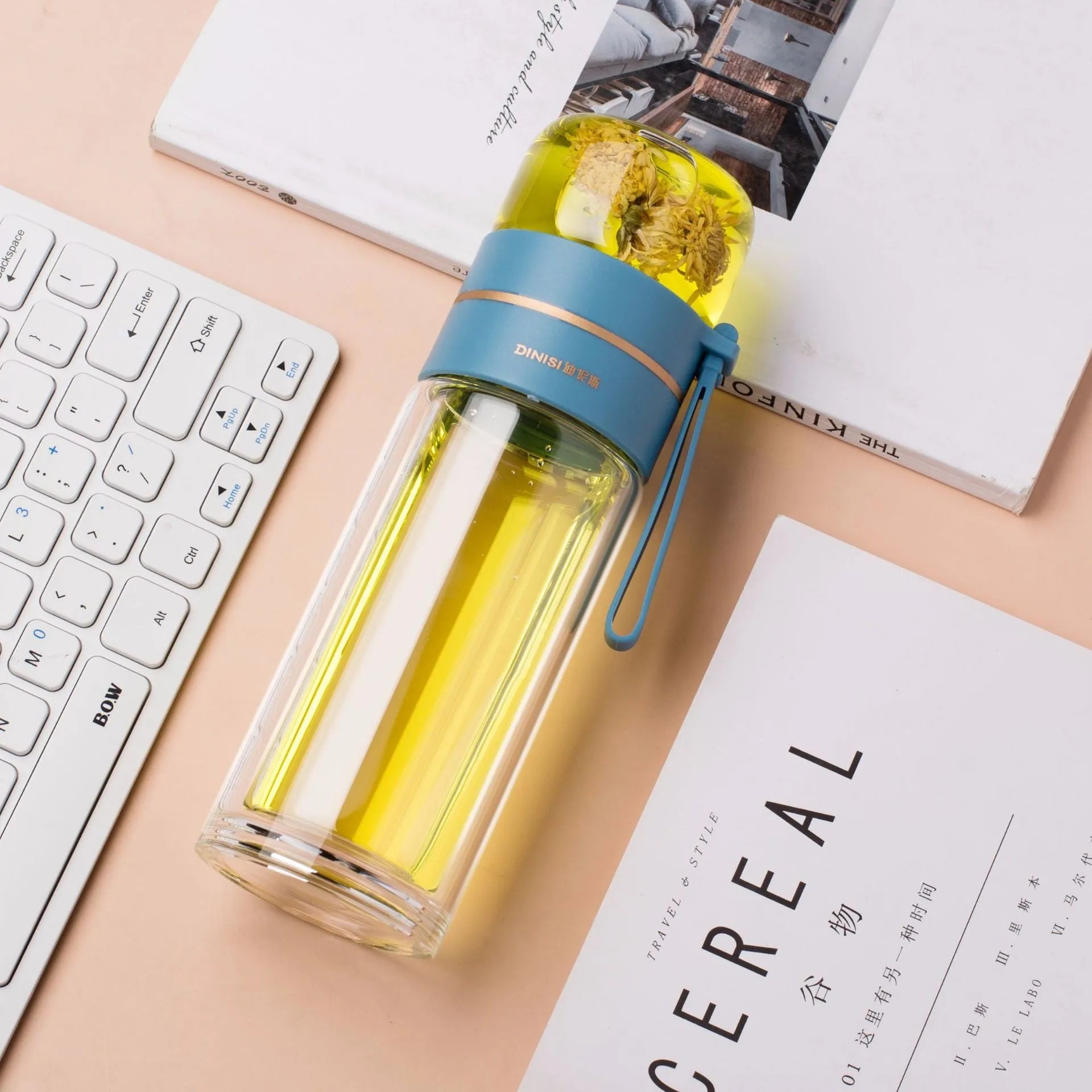 Glass water bottle with tea infuser filter showing double wall construction and portable rope