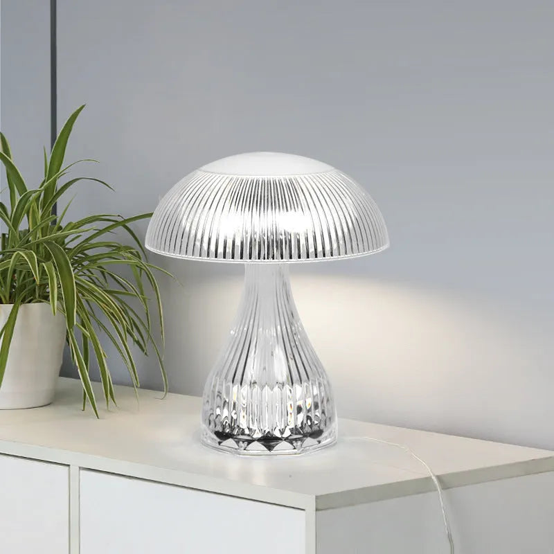 Small white rechargeable night lamp with USB port and colour-changing LED light on a table.
