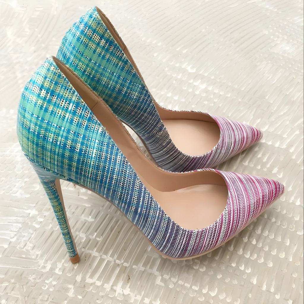 Ladies pink-blue gradient patent leather pointed toe stiletto heels with a tall thin heel on a rubber sole.