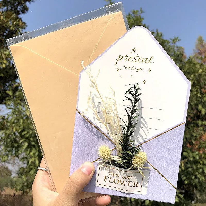Handmade 3D boxed birthday card with butterfly shape and artificial flowers.
