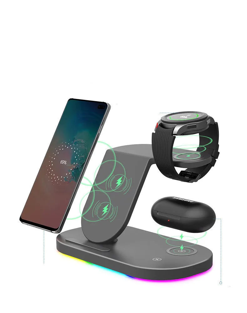 White three-in-one wireless charger showing phone, watch, and headphone charging pads with a Type-C cable.