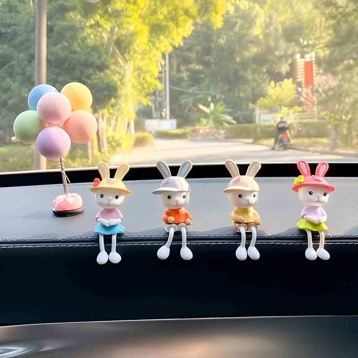 Cartoon rabbit car decoration set with four sitting rabbit figures in plain, pink flower, colourful balloon or travel balloon style