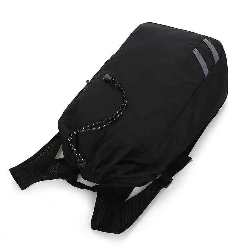 Black nylon backpack gym bag, 30 x 17 x 56cm, with zip pocket and three carry modes