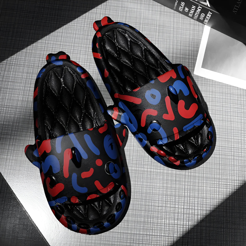Pair of grey EVA foam open-toe slippers with a raised shark fin design on the front.
