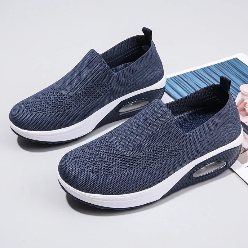 Women's black mesh running shoes with round toe and mid heel on a white background