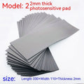Black and grey plastic light-sensitive mat for seal carving in three thicknesses.