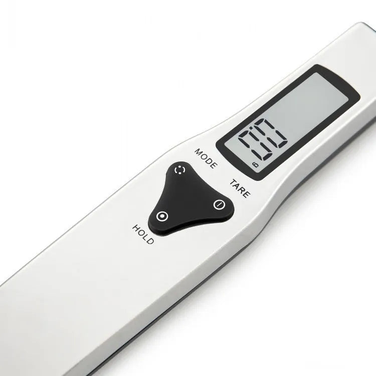 Digital measuring spoon with electronic display showing weight measurement in grams