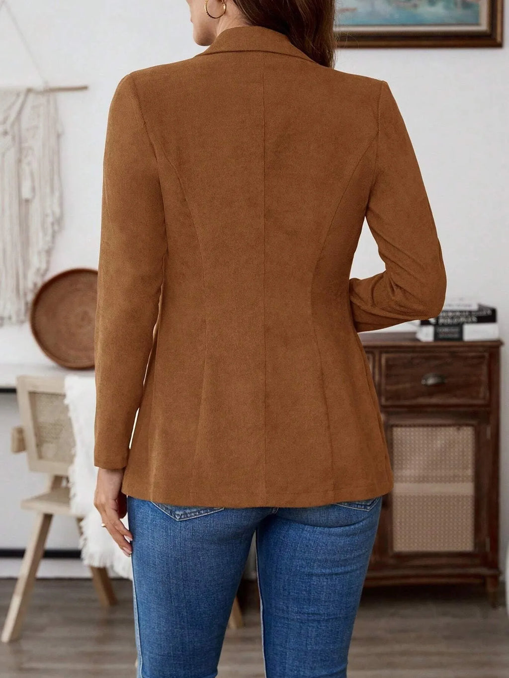Brown men's single-breasted lapel leisure suit coat on a hanger.