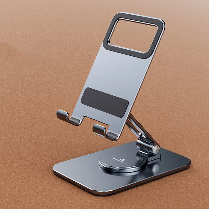 Folding aluminium alloy mobile phone stand in silver on a desktop showing rotary orientation