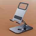 Folding aluminium alloy mobile phone stand in silver on a desktop showing rotary orientation
