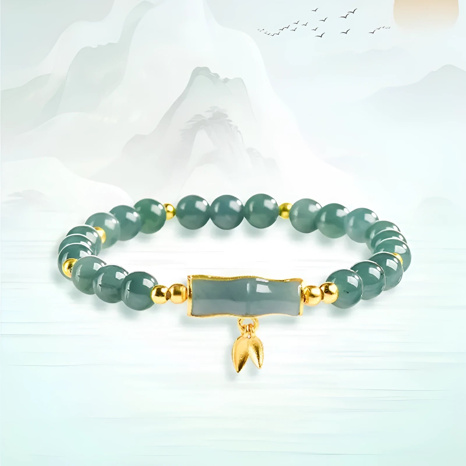 Simple sterling silver bracelet with a raised setting holding a natural blue jade round bead.