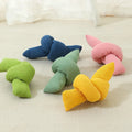 White knotted cotton rope dog toy for chewing and tug of war.
