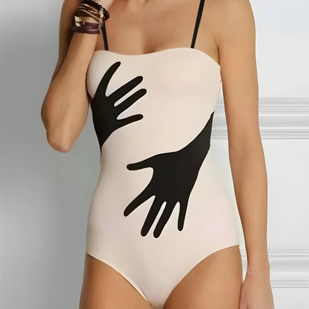 Women's one-piece bikini swimsuit with a gauze skirt, made from polyester fibre.