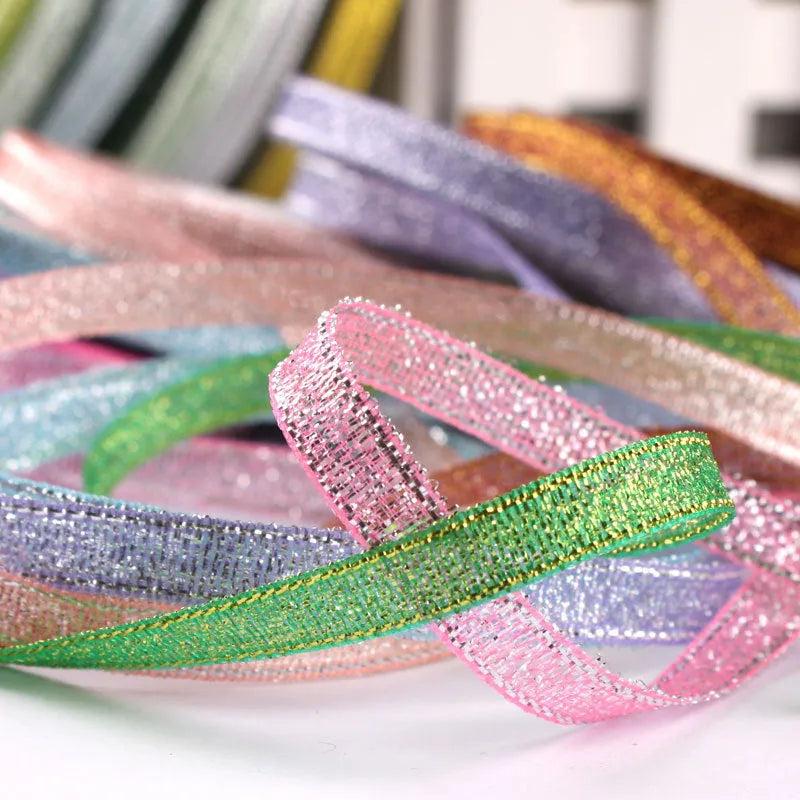 Roll of 0.6cm wide decorative polyester ribbon in a choice of 21 colours including metallic options.
