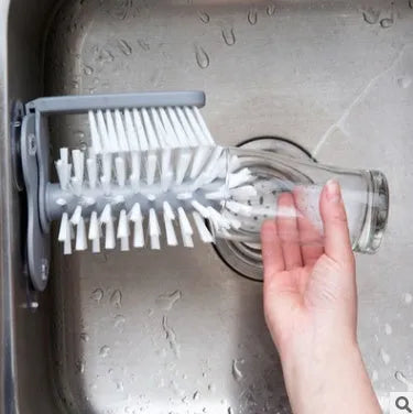 Grey rotating cup brush with suction cups for wall mounting and double cleaning heads