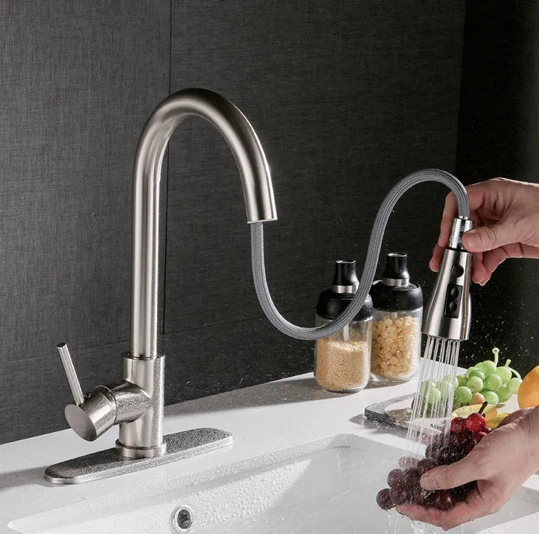 Pull-out hot and cold kitchen faucet with brushed copper finish and single lever lift on a kitchen sink
