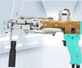 Electric needle carpet tufting loom 120W cut pile gun in green silver finish on workbench