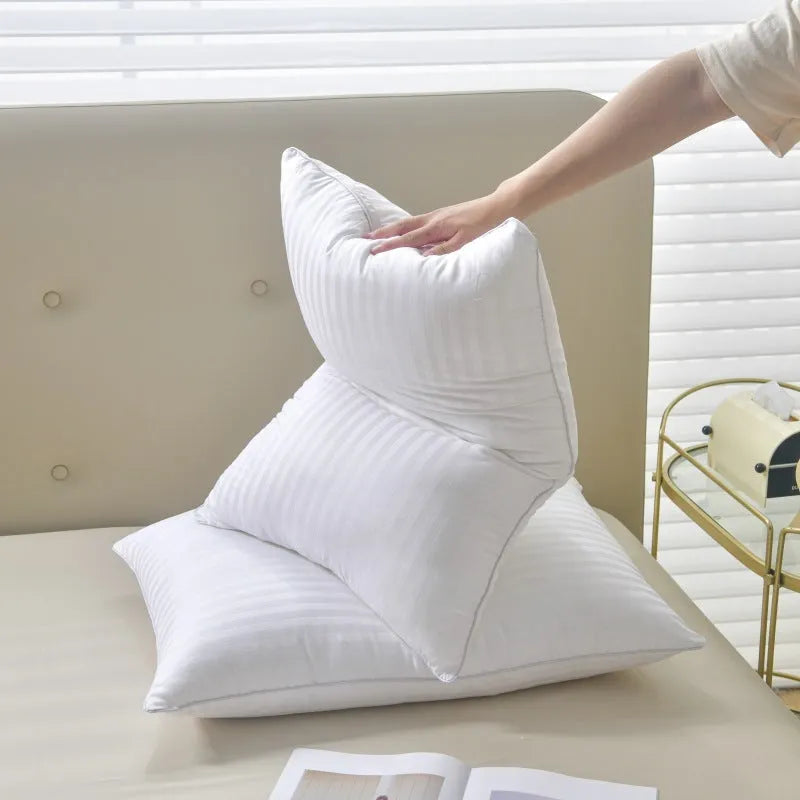 White cotton pillow with a thin satin stripe, showing feather cotton filler and three size options.