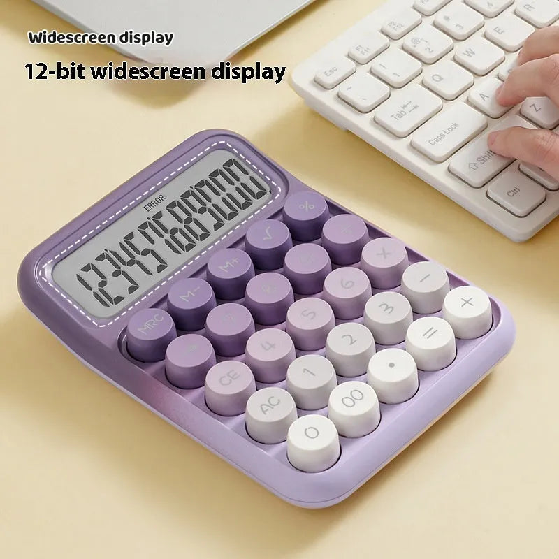 Gradient colour round mechanical keyboard calculator in muted blue, green, pink, or purple on a desk.