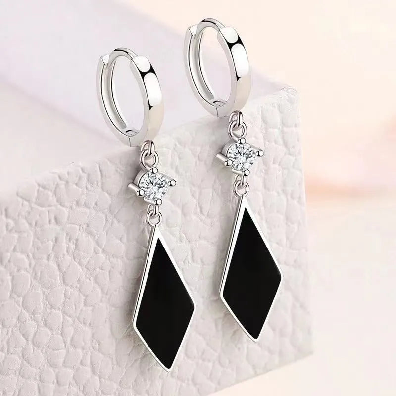 A pair of silver vintage diamond geometric clip-on earrings for women.