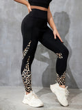 Black women's high-waist fitness leggings with colour-contrast patchwork patterns and side pockets.
