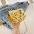 Women's PU leather mini tote crossbody bag in saddle silhouette with single shoulder strap