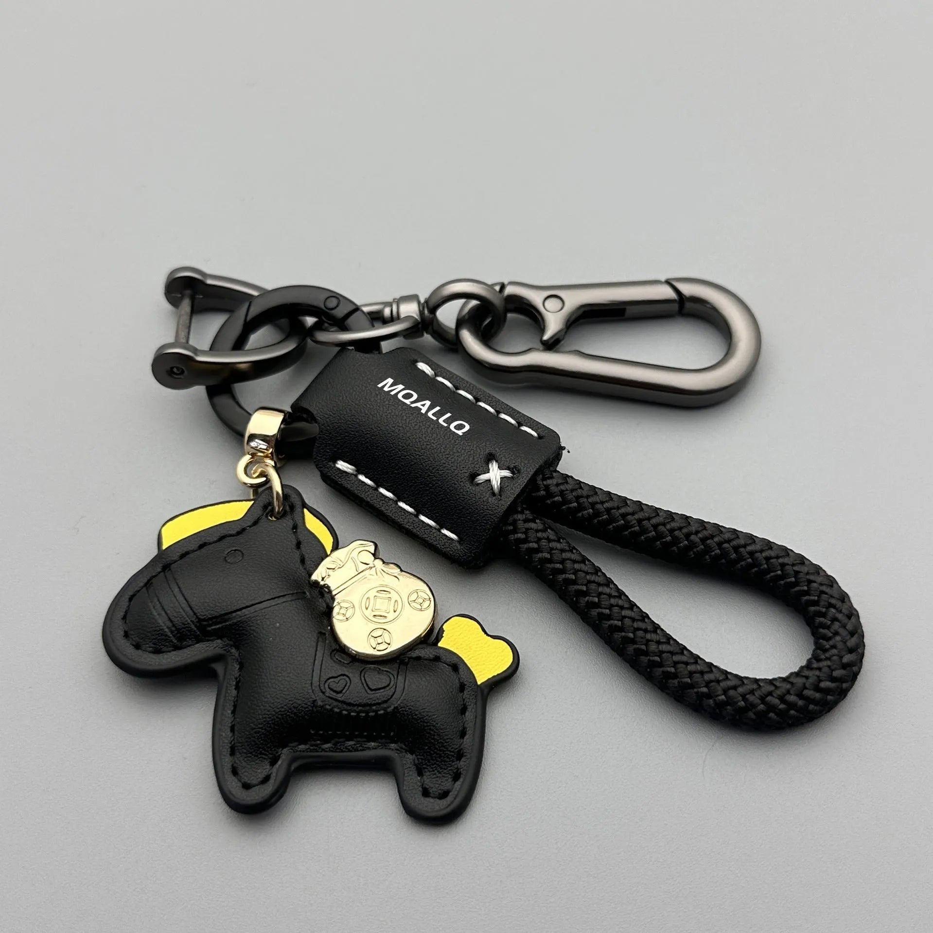 Handmade brown cowhide leather keychain with a silver pony belt buckle charm and green velvet rope.