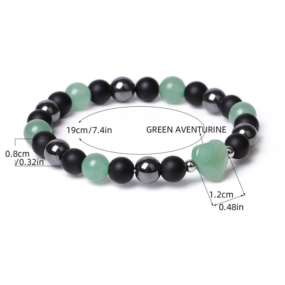Hand-cut geometric peach heart stone bracelet with moon symbols in tigereye colour