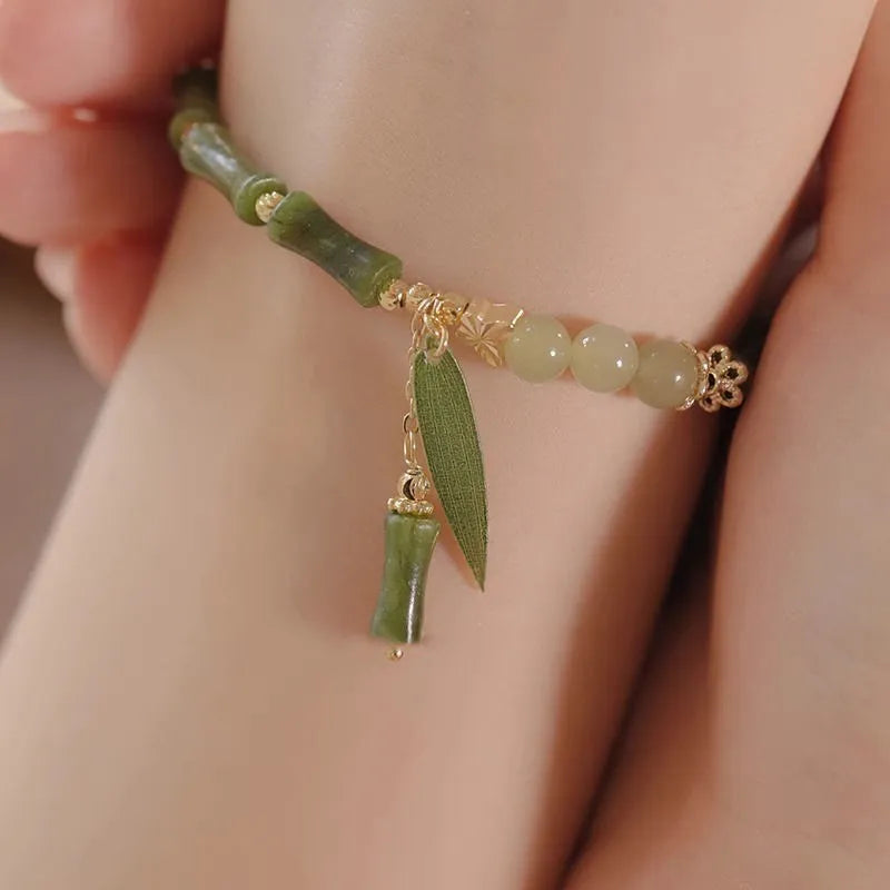 Chinese style glass bracelet with bamboo joint design elements in multiple colour options