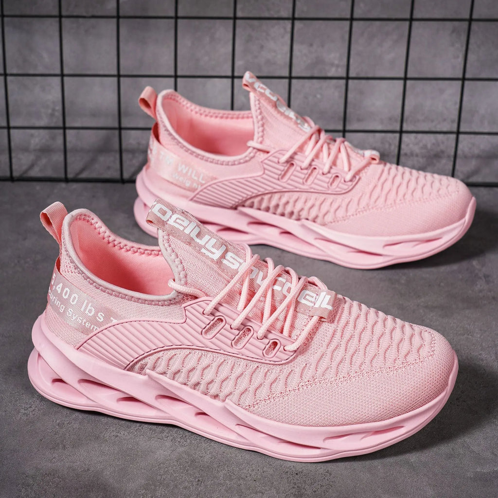 Women's lightweight FlyKnit mesh casual trainer in solid colour on a white background.