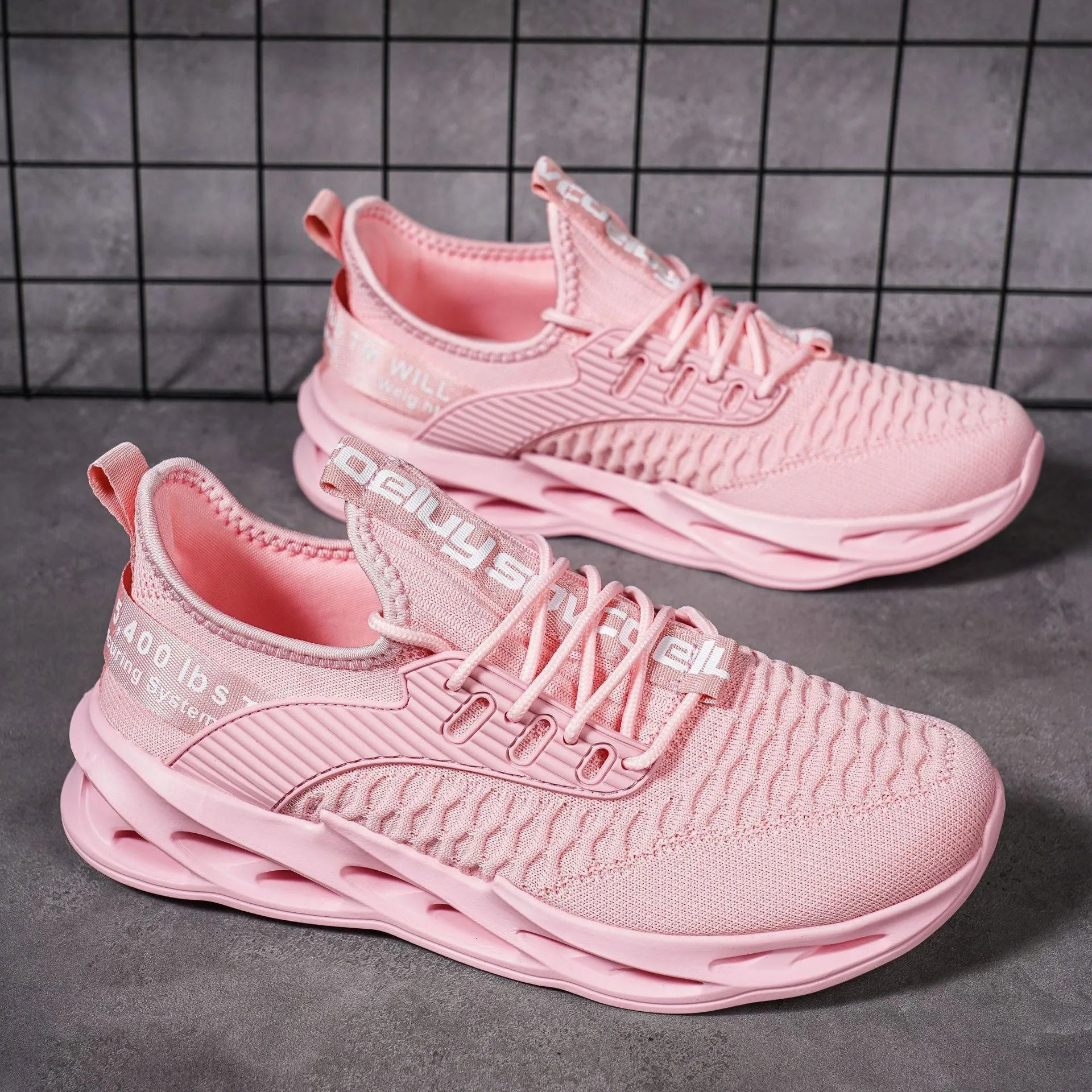 Women's lightweight FlyKnit mesh casual trainer in solid colour on a white background.