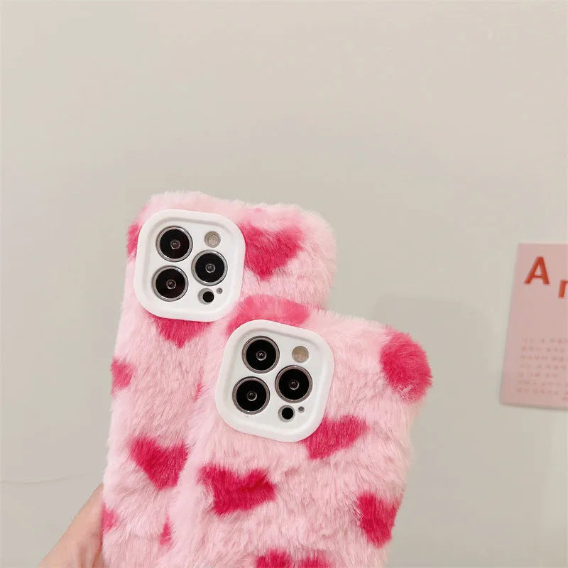 Pink silicone phone case with cartoon design for iPhone models 12, 13, 14, and 15.