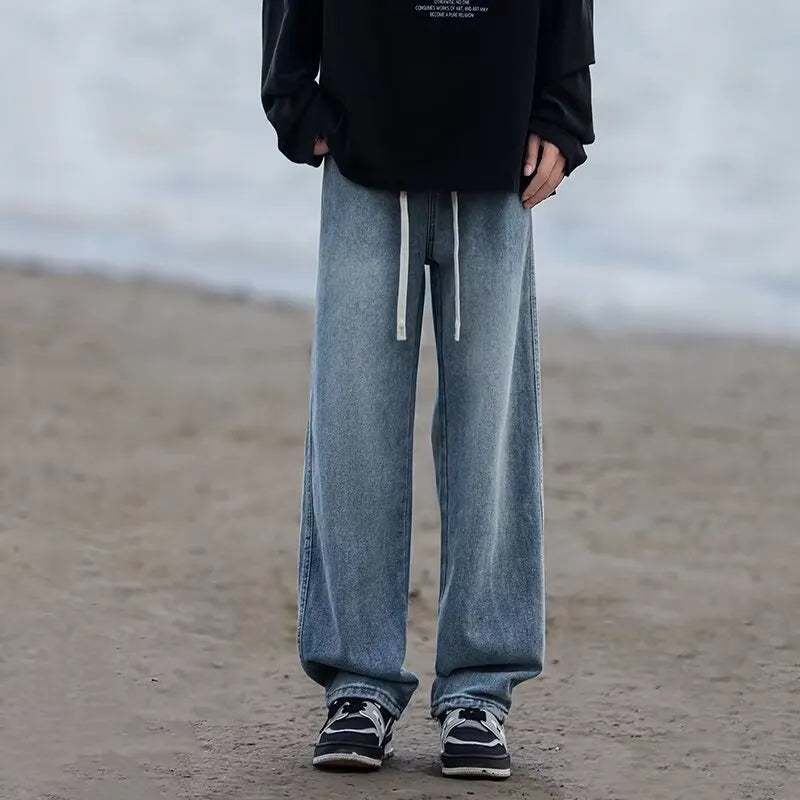 Men's straight-leg cotton jeans trousers in loose fit with drawstring waist