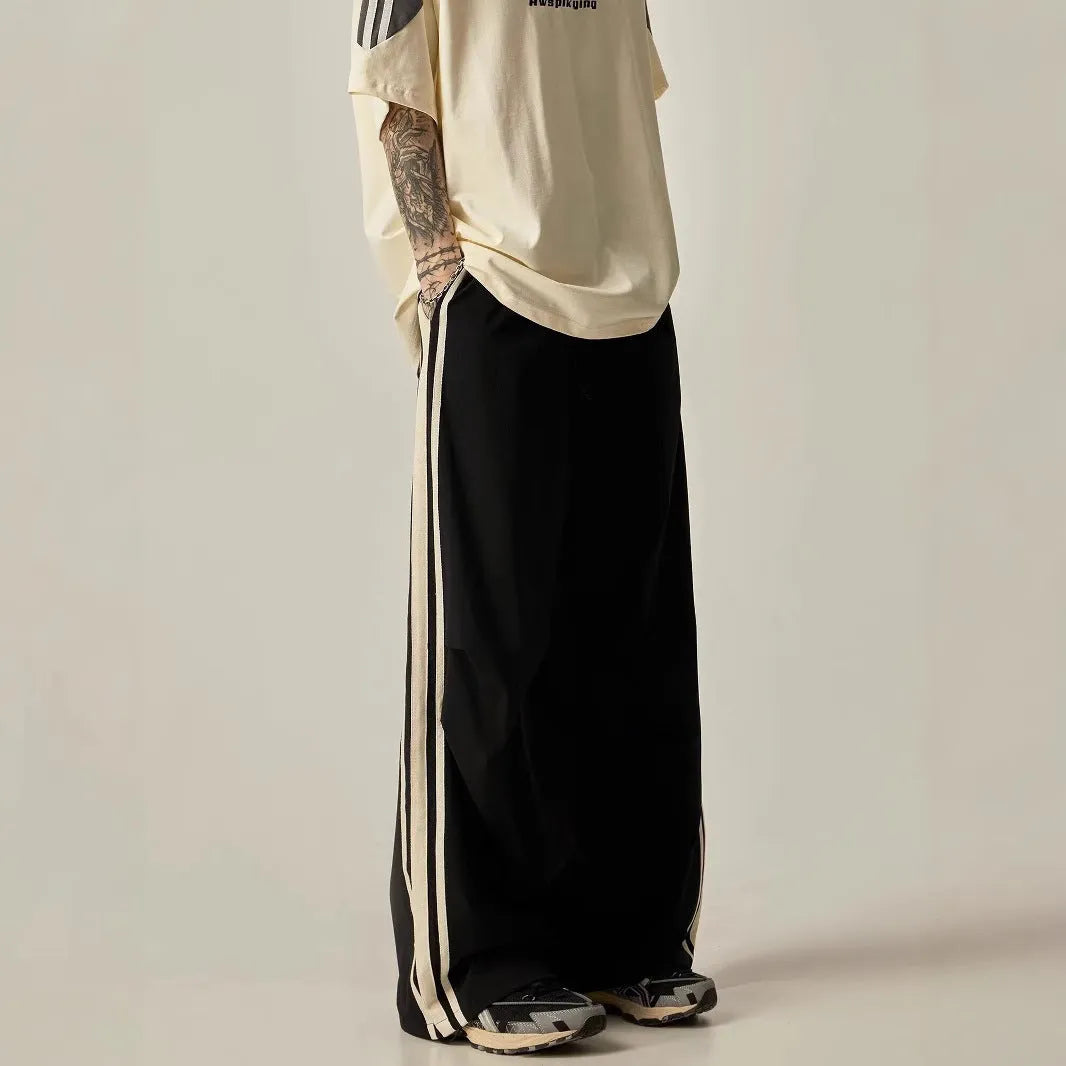 Black wide-leg climbing trousers for men with high waist and straight-leg design.
