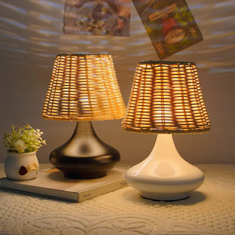 Bamboo desk lamp with black iron art base, USB cable, and warm light glow on a wooden table