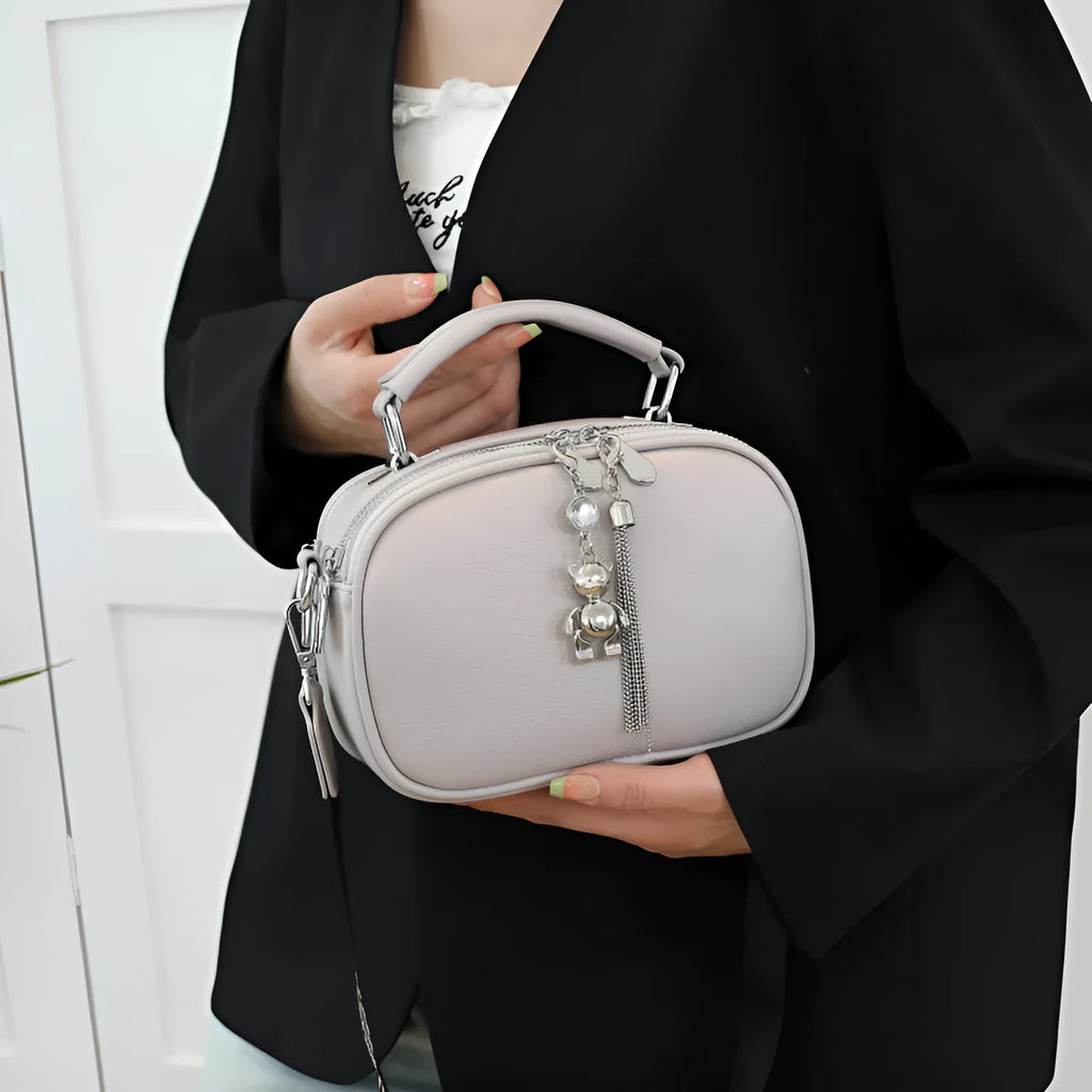 Women's stitching small square bag oval design showing mobile phone compartment and double shoulder straps