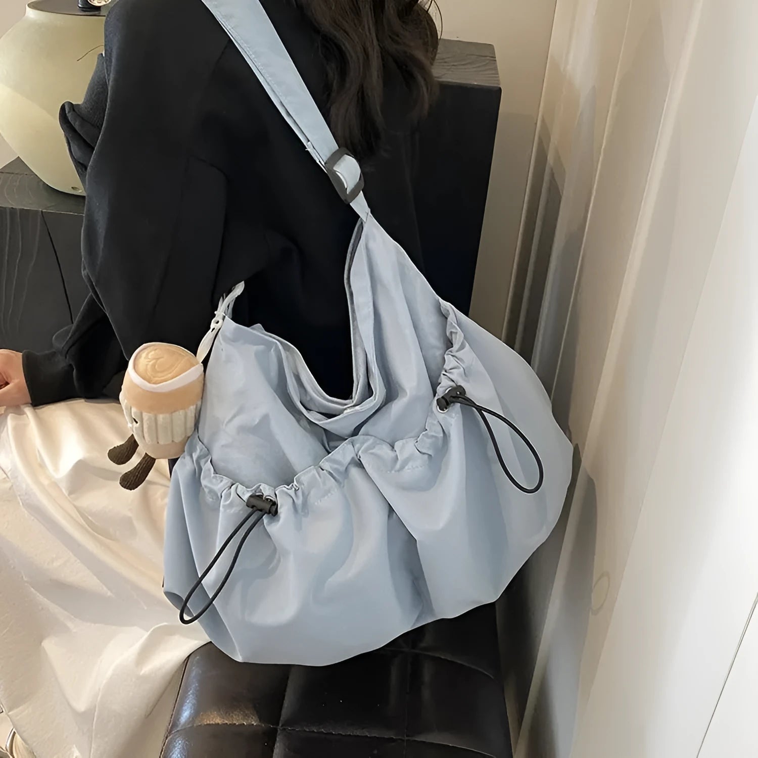 Foldable pleated polyester crossbody bag in street style, showing split pockets and a green colour option.