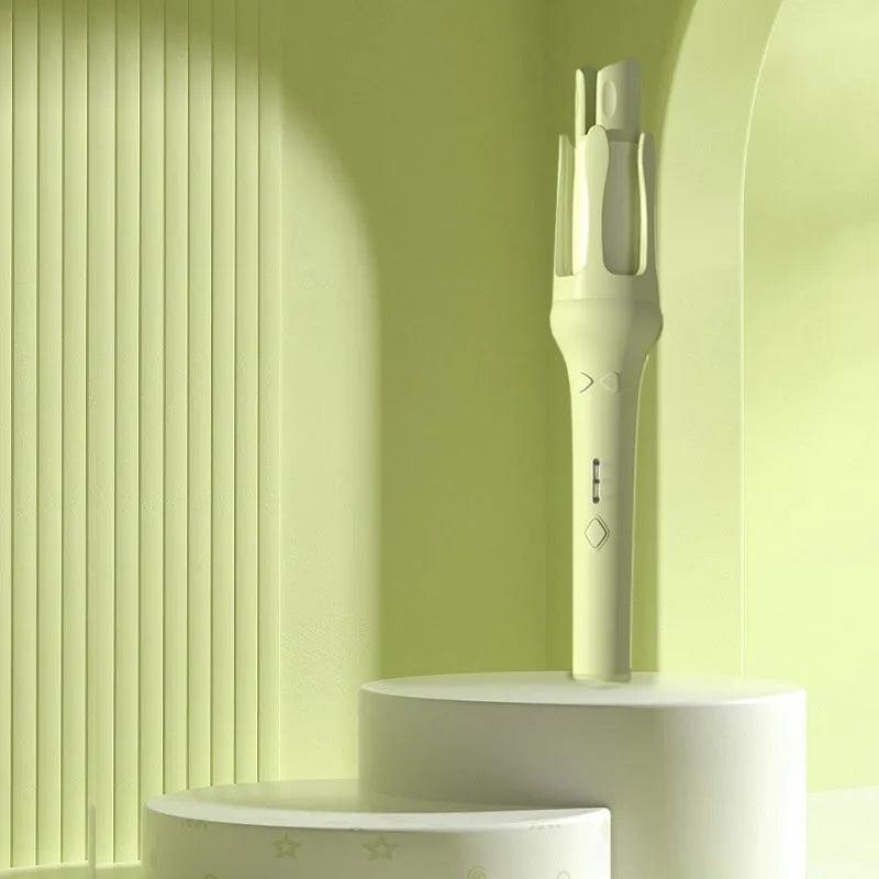 White and pink automatic hair curler with 32mm ceramic barrel and international power plugs on a table.