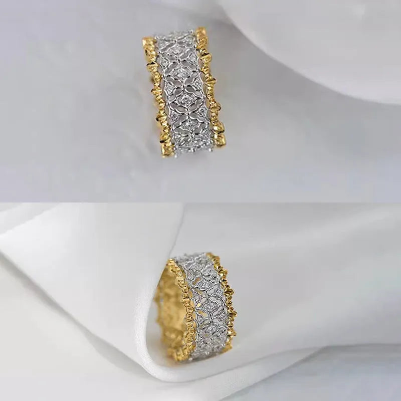 Geometric two-tone copper ring with a round zircon stone, shown on a hand.