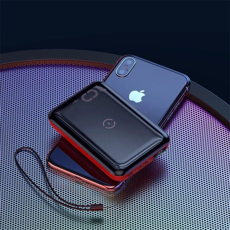 Small square black 10000mAh power bank with wireless charging symbol and digital display.