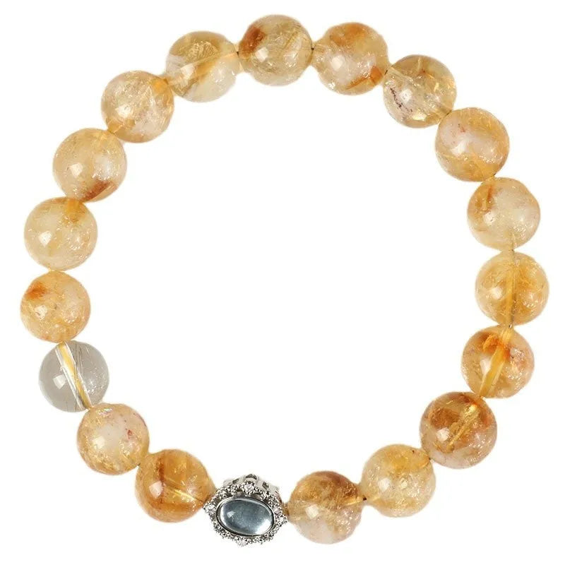 Citrine colour crystal bracelet with 10mm geometric beads on a wrist.
